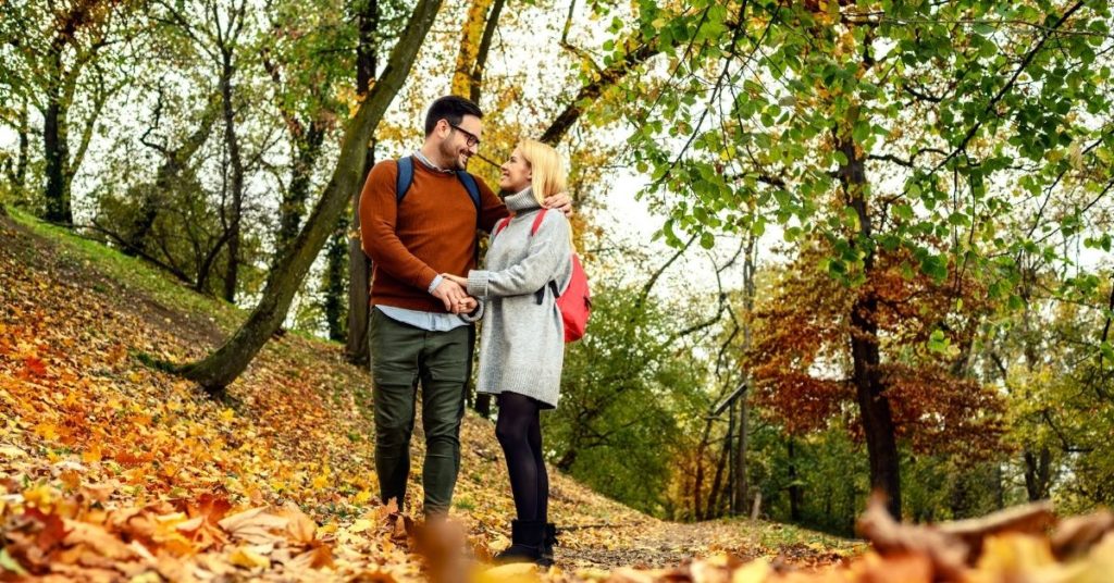 man and woman on an autumn walk