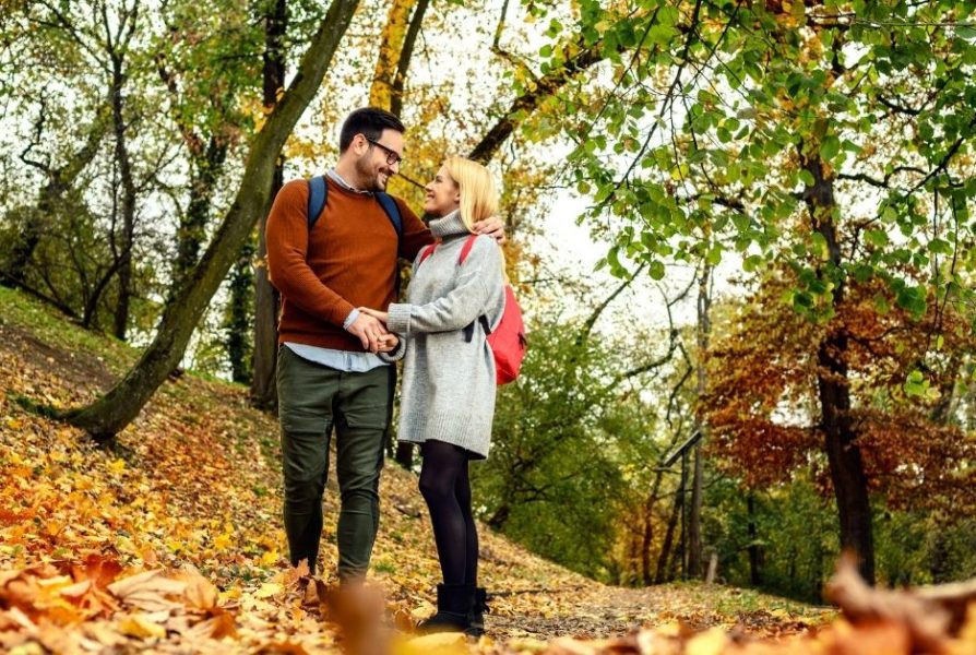 man and woman on an autumn walk