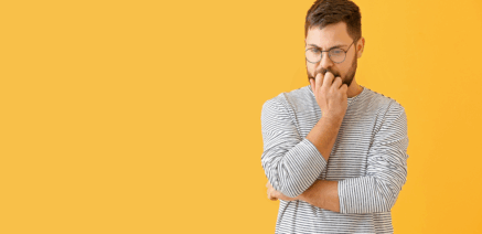 Middle-aged man thinking about a health check, representing Men’s Health Month awareness in Neath, South Wales.